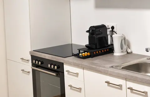 Küche mit Kaffeemaschine · CityFlat Wels